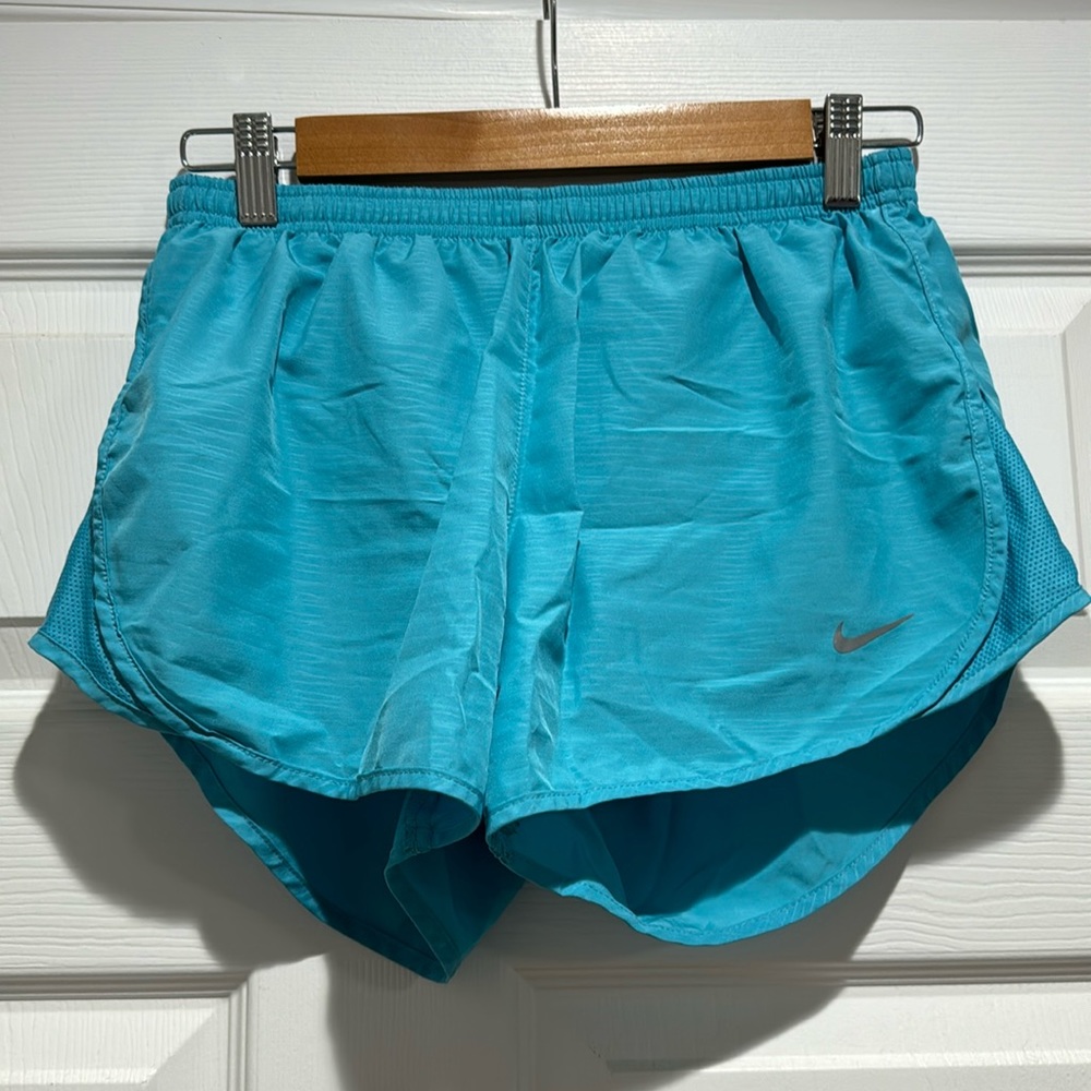 Blue Nike running shorts